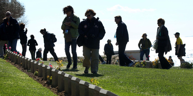 Tourists walk among the headstones at Ari Burnu Cemetery on the Gallipoli Peninsula. Photo / Alan Gibson