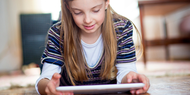 Research shows that 75 to 80 per cent of parents use technology to placate or distract children. Photo / Getty Images