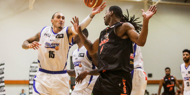 Wellington Saints forward Leon Henry vies for possession in the Saints' season-opener. Photo / Paul Taylor