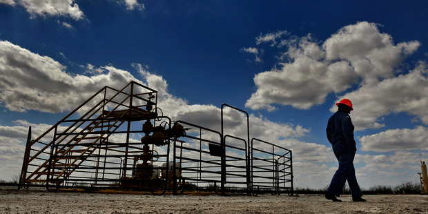 Swift Energy chief Terry Swift walks the grounds at a company drilling site in Tilden, Texas. Washington Post photo / Michael S. Williamson