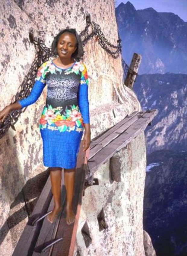 One photo saw her plonked barefoot on to the would's most dangerous hiking trail on Mount Huashan. Photo / Facebook