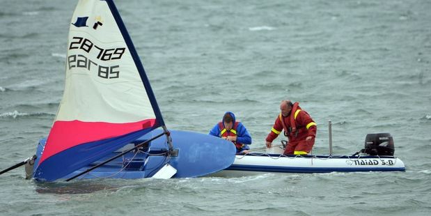 Thomas George spent 40 minutes in the Otago Harbour this morning after capsizing his yacht before being rescued by his father. Photo / Stephen Jaquiery