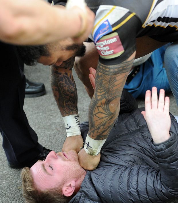 Junior Sa'u of Salford Red Devils confronts a fan. Photo / Graham Crowther - GAC photos