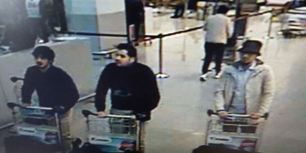 Najim Laachraoui (left) and Ibrahim El Bakraoui are shown in CCTV footage wearing one glove but authorities are still searching for the man in the hat. Picture / AP