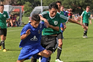 Jerahl Hughes (left) tussles with Onehunga's Kyosuke Kitand in Tauranga City United's season opening win. Photo / Stuart Whitaker