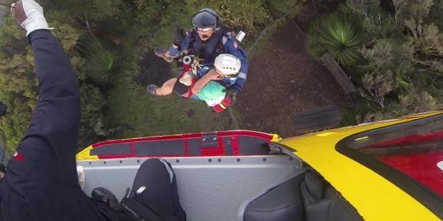 Rescue crews winch Aaron "Dogga" to safety.