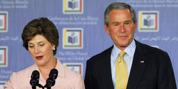 Laura Bush and George W. Bush speak at the White House Literacy Conference. Photo / Getty Images