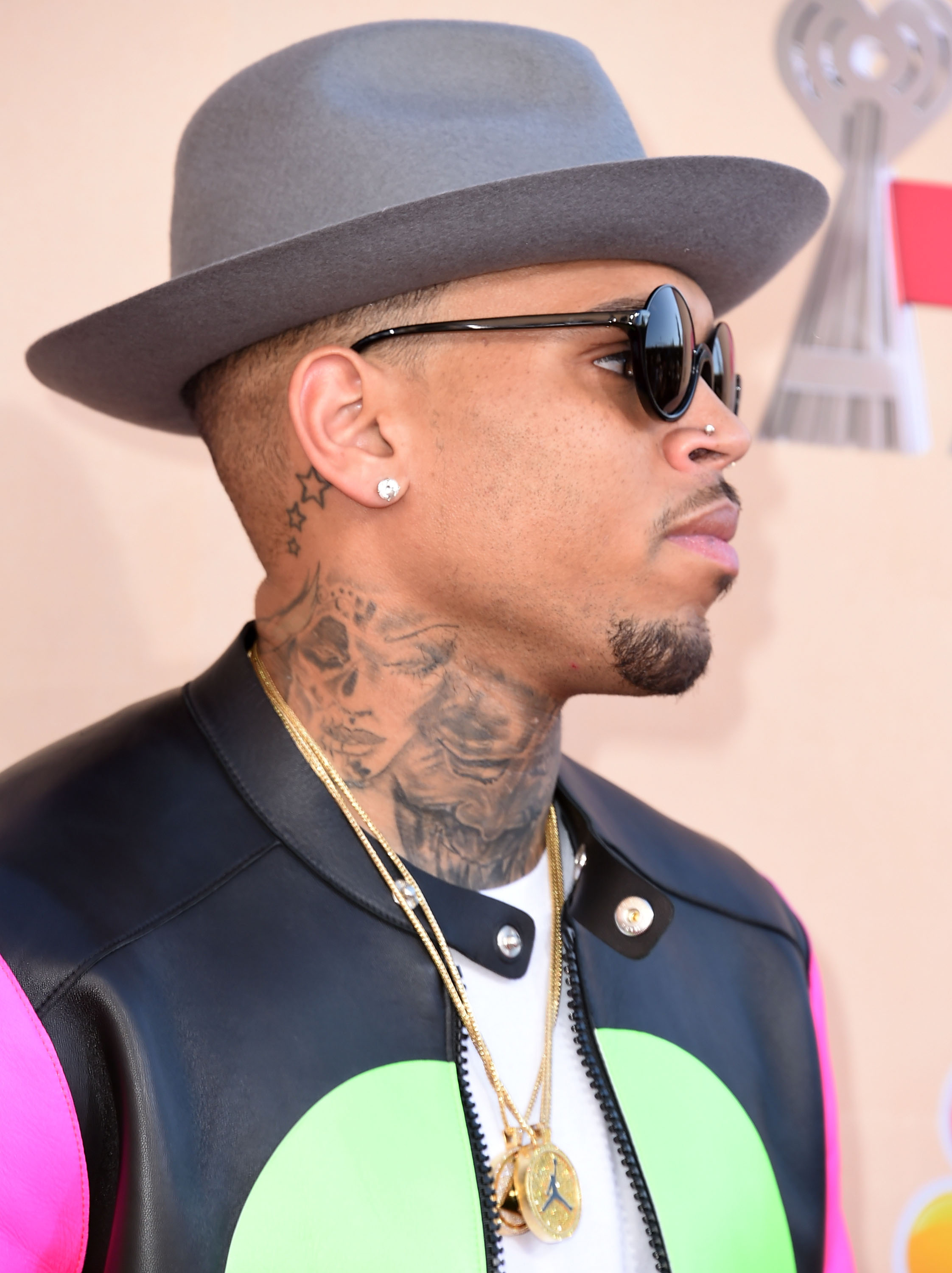 Chris Brown shocked fans with his 'beaten woman' neck tattoo. Photo / Getty Images