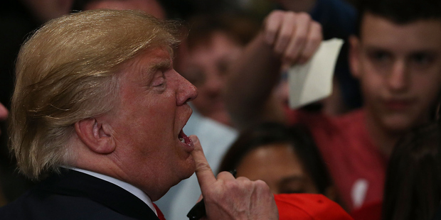 Donald Trump greets supporters. Photo / Getty Images