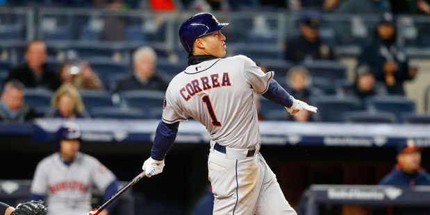 Carlos Correa follows through on his fifth inning home run against the New York Yankees. Photo / Getty Images