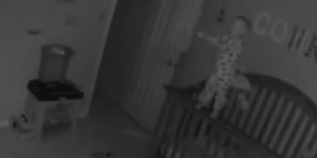 While some were quick to shun the idea of paranormal activity, many believe the footage of the child pulling himself up to stand on the railing of his cot is genuine. Photo / YouTube, Chris and Keelan Chronicles