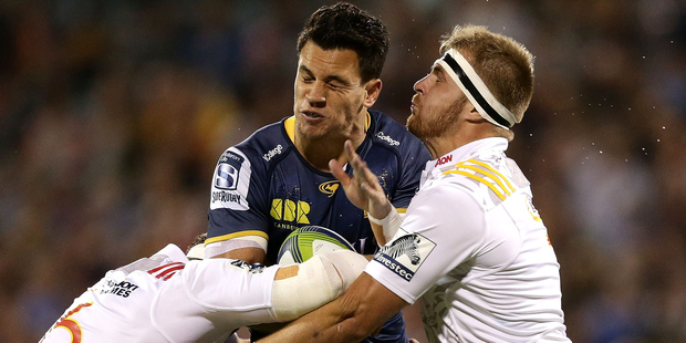 Brumbies back Matt Toomua is crunched by two Chiefs defenders in Tom Sanders and Sam Cane (right) in Canberra last Saturday. Photo / Getty Images