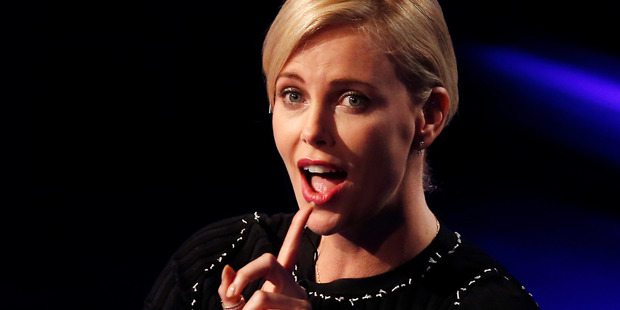 Charlize Theron says her comments to GQ were taken out of context.