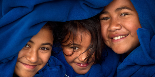 WRAPPED UP: Owhata School pupils (from top) Moana Pakuru, 10, Cadence Morrell, 10, and Kaylee Davies, 10 wrap up warm. PHOTO/STEPHEN PARKER