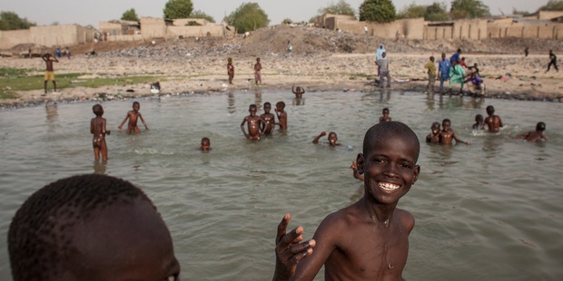 Children play by the river in Maiduguri, Nigeria. Photo / Jane Hahn, Washington Post