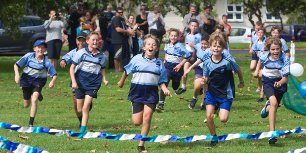 The boys give their all at the finish line. Photo / Stephen Parker