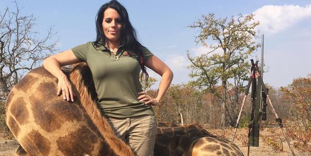 Sabrina Corgatelli has posted pictures on social media of her standing over a dead giraffe in South Africa. Photo / Facebook