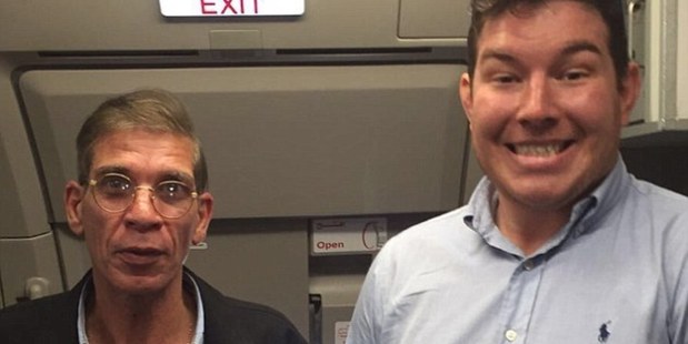 Seif Eldin Mustafa, is seen wearing his 'suicide belt' - later found to be fake - as he poses for a picture with 26-year-old Brit Ben Innes.