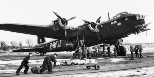 World War II Stirling bomber crew bombing up in 1943 at Mildenhall in the United Kingdom.