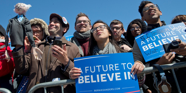 Members of the audience listen as Democratic presidential candidate, Senator Bernie Sanders, speaks at a rally on the Coney Island boardwalk of Brooklyn. Photo / AP