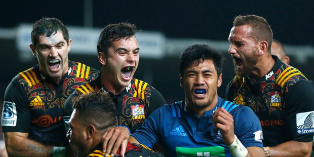 (L-R) Stephen Donald,James Lowe and Aaron Cruden celebrate the try from Seta Tamanivalu (13). Photo / Getty Images.