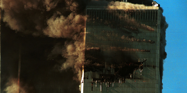 Smoke pours from the World Trade Center after it was hit by two planes September 11, 2001 in New York City. Photo / Getty