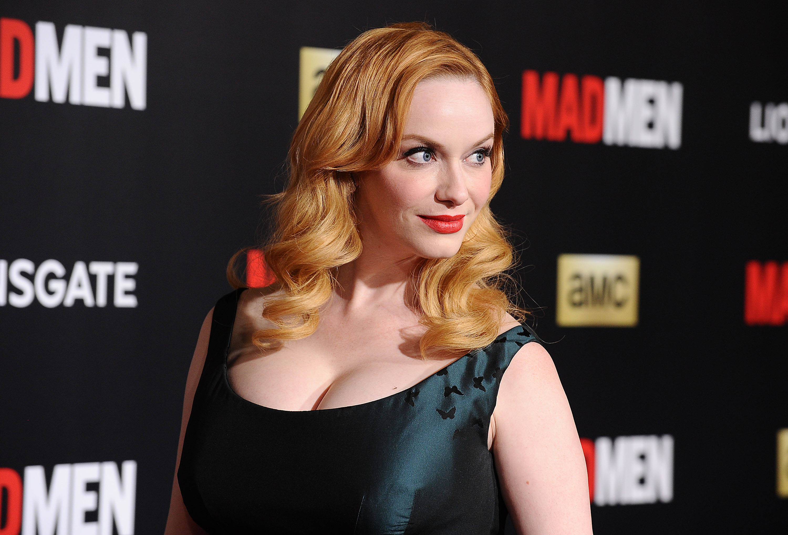 Christina Hendricks' outfits in Mad Men fit like a glove because they've been tailored to her figure. Photo / Getty