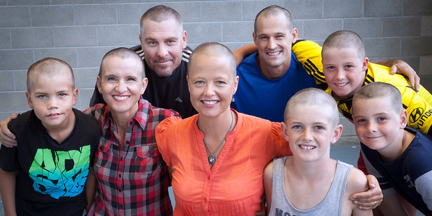 Nick Reeder, Sarah Jane Little, Patrick McDaniel, Meg Ryan, Dave Taylor, Toby Miller (front) Ryan Taylor, and Rylan Griffin all shaved their heads for the cause. Photo/Andrew Warner