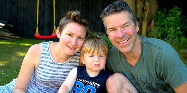 Elaine and Aaron Brown with their son Alex, 2, who looks forward to the family's Tuesday rubbish collection. Photo / Supplied