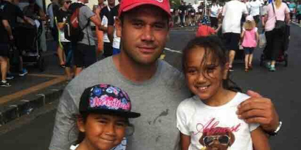 Former Blues rugby player Kurtis Haiu and his daughters, Sienna, 6, (left), and Aaliyah, 8 during the Round The Bays run. Photo / Supplied