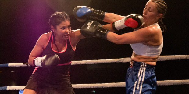 Royal Rampage. In Black: Mia St John vs In white: Lisa Lewis, The Trusts Area, Auckland. Photo / Steven McNicholl