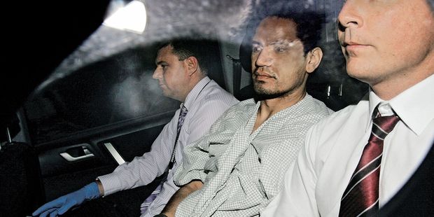 Morehu-Barlow, centre, in police custody in 2011. Photo / Supplied