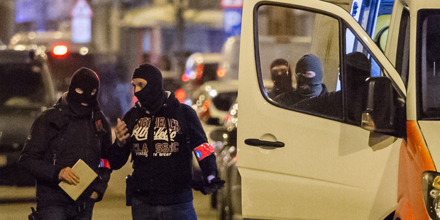 Police investigate an area where terror suspect Mohamed Abrini was arrested in Brussels on Friday. Photo / AP