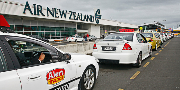 Taxis waiting outside the domestic terminal at Auckland International Airport. Photo / File