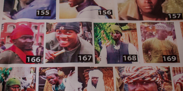 A 'Most Wanted' poster depicting alleged Boko Haram' fighters, in Maiduguri, Nigeria. Photo / The Washington Post by Jane Hahn.