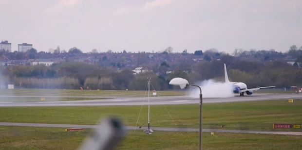 The jet disappeared behind a cloud of smoke shortly after landing. Photo / YouTube, Ryan Kirkpatrick