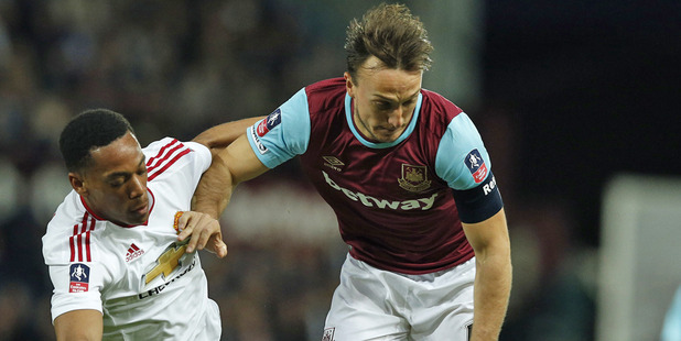 Mark Noble and West Ham went down 2-1 to Manchester United. Photo / AP