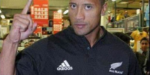 The Rock wears his All Blacks jersey with pride.