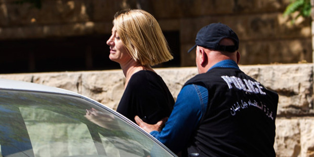 TV presenter Tara Brown is escorted from court on April 18, 2016 in Beirut, Lebanon. Photo / Getty Images