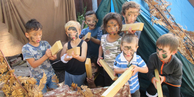 ABC Kawaha Point kids play war games. Photo / Supplied