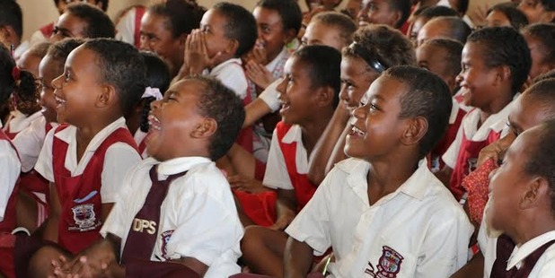 Fijian school kids show their appreciation. Photo / Corinne Ambler/IFRC