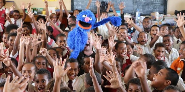 School kids with Grover. Photo / Corinne Ambler/IFRC