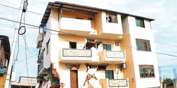 People search a building in Canoa, Ecuador which collapsed in the 7.8 magnitude earthquake. Photo / Supplied