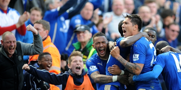Everybody at Leicester City loves a pizza the action. Picture / AP