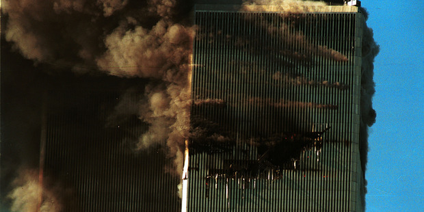 Smoke pours from the World Trade Center after it was hit by two planes September 11, 2001 in New York City. Photo / Getty