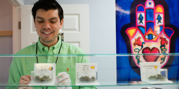 Takoma Wellness Center is a family run medical marijuana dispensary in Washington, DC. Employee, David Malpica, sets up the dispensary room before business hours. Photo / Getty