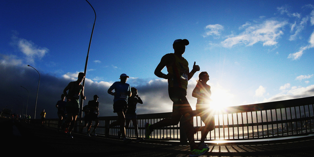 Runners run over the Auckland Harbour Bridge during the 2015 Auckland Marathon. Photo / Getty Images