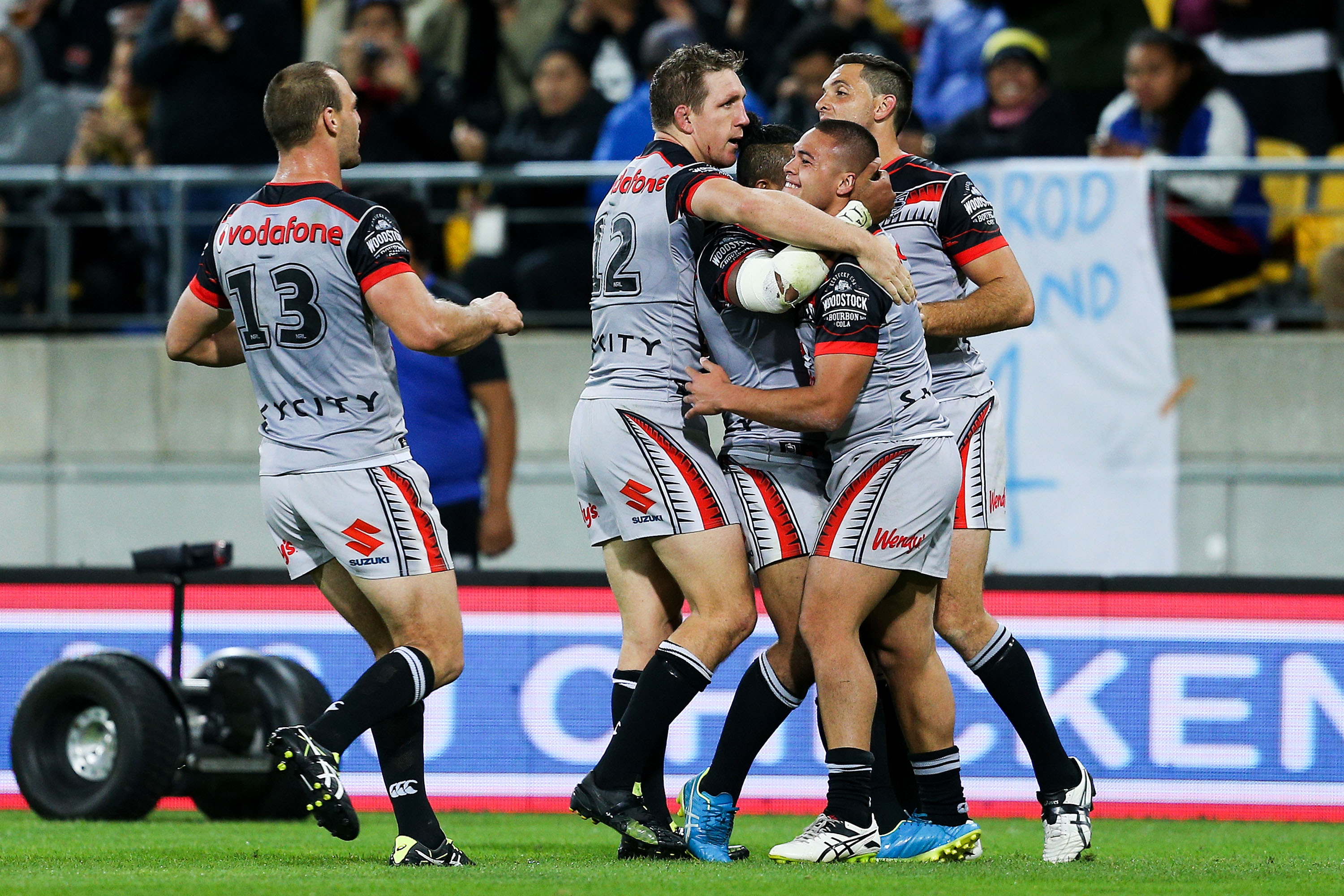Tui Lolohea is congratulated by teammates following his second-half try against the Bulldogs. Photo/Getty.