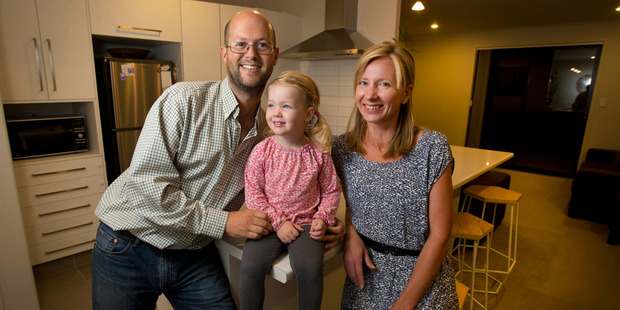 Former Aucklanders James Rea (left) and Ivana Rea, with daughter Alexis Rea, 2, in their new house in Papamoa. Photo / Alan Gibson