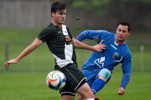 Andrew Cooper (right) wins possession against Jack Anderson from Bay Olympic at Links Avenue on Sunday. Photo / George Novak